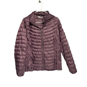 HeatKeep size medium puffer coat dark purple color does have a flaw on arm